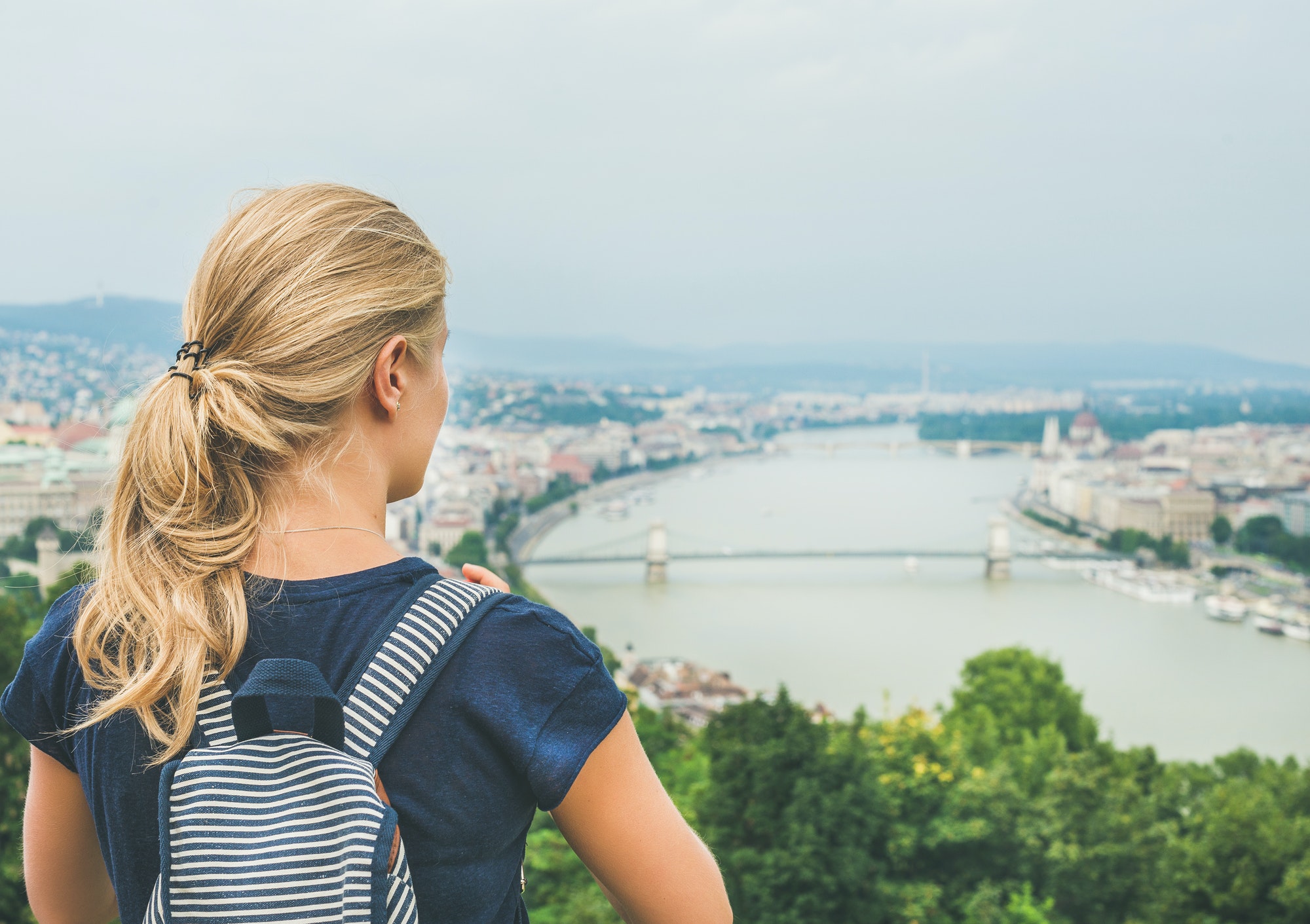 young-woman-traveler-looking-at-danube-river-budapest-hungary.jpg
